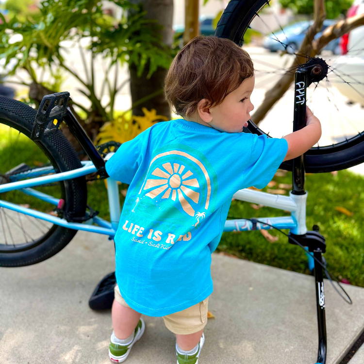 kids tshirt blue with surf skate good vibes pattern design toddler tshirt fixing bmx bike